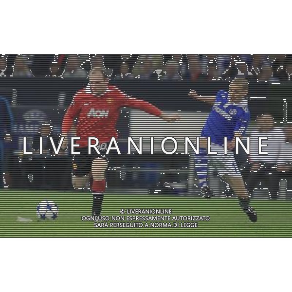 WAYNE ROONEY (L) PEER KLUGE (P) SCHALKE 04 GELSENKIRCHEN (NIEBIESKO-BIALE - BLUE-WHITE) - MANCHESTER UNITED (CZERWONO-CZARNE / RED-BLACK) PILKA NOZNA, FOOTBALL, 1/2 FINALU LIGI MISTRZOW, CHAMPIONS LEAGUE SEMI-FINAL 26.04.2011, GELSENKIRCHEN - NIEMCY, GERMANY FOT. DARIUSZ HERMIERSZ / SPORT-FOTO.PL / NEWSPIX.PL --- Newspix.pl ag aldo liverani s a s only italy *** Local Caption *** www.newspix.pl mail us: info@newspix.pl call us: 0048 022 23 22 222 --- Polish Picture Agency by Ringier Axel Springer Poland