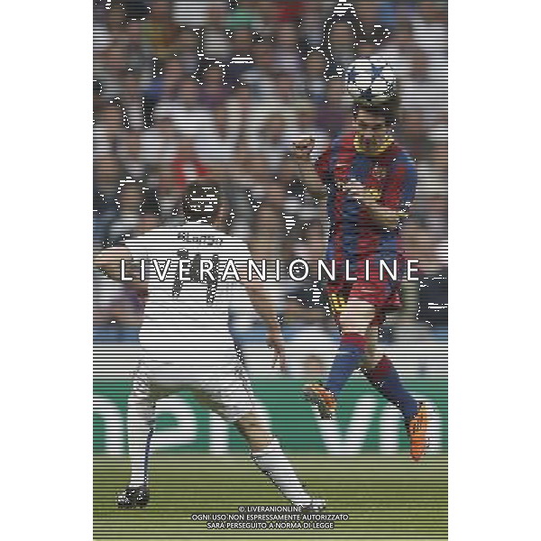 Real Madrid\'s Xabi Alonso and Barcelona\'s Lionel Messi during Champions League semifinal first match on April 27 2011. Photo: Cesar Cebolla / ALFAQUI AG ALDO LIVERANI S A S ONLY ITALY