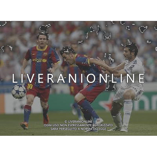 Real Madrid\'s Raul Albiol and Barcelona\'s David Villa and Lionel Messi during Champions League semifinal first match on April 27 2011. Photo: Cesar Cebolla / ALFAQUI AG ALDO LIVERANI S A S ONLY ITALY