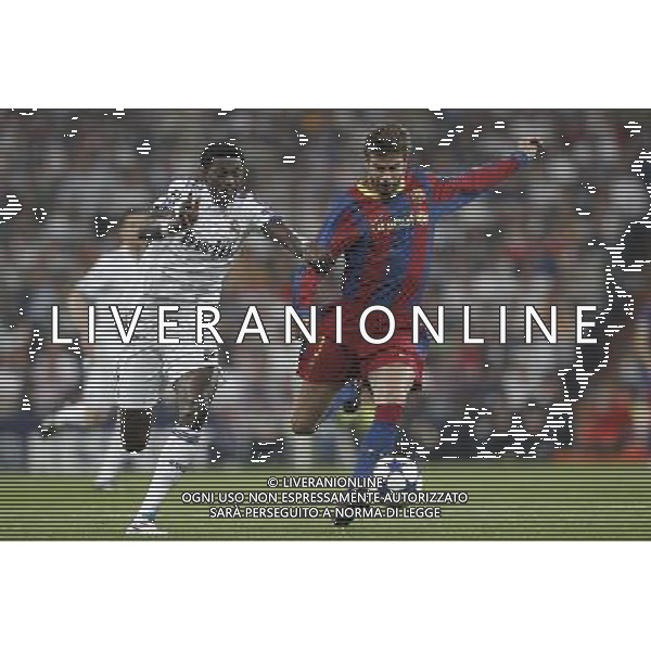 Real Madrid\'s Emanuel Adebayor and Barcelona\'s Gerard Pique during Champions League semifinal first match on April 27 2011. Photo: Cesar Cebolla / ALFAQUI ag aldo liverani only italy