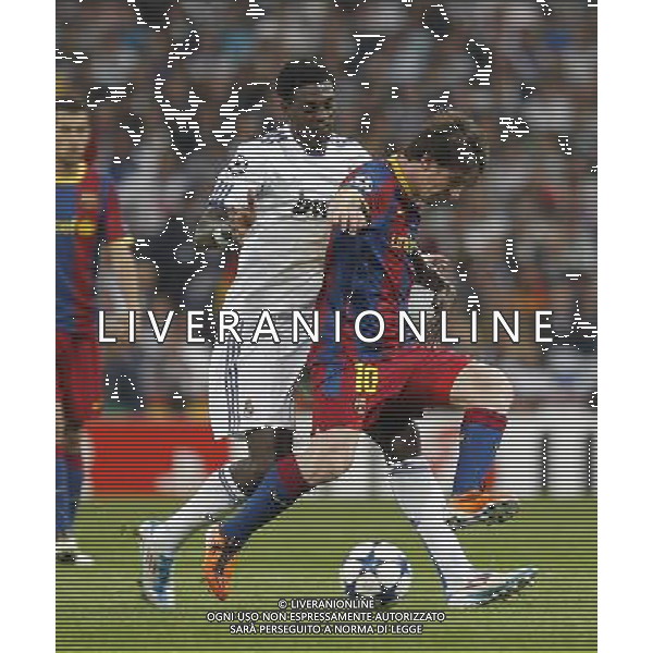 Real Madrid\'s Emanuel Adebayor and Barcelona\'s Lionel Messi during Champions League semifinal first match on April 27 2011. Photo: Alex Cid-Fuentes / ALFAQUI AG ALDO LIVERANI ONLY ITALY