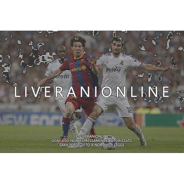 Real Madrid\'s Raul Albiol and Barcelona\'s Lionel Messi during Champions League semifinal first match on April 27 2011. Photo: Alex Cid-Fuentes / ALFAQUI AG ALDO LIVERANI ONLY ITALY