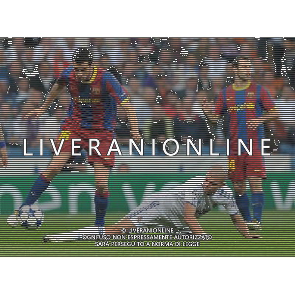 (110428) -- MADRID, April 28, 2011 () -- Pepe (Bottom) of Real Madrid slide-tackles during the first leg match of Champions League semi-final against Barcelona at Santiago Bernabeu Stadium in Madrid, Spain, April 27, 2011. Real Madrid lost 0-2. (/Chen Haitong) (bxf) AG ALDO LIVERANI ONLY ITALY