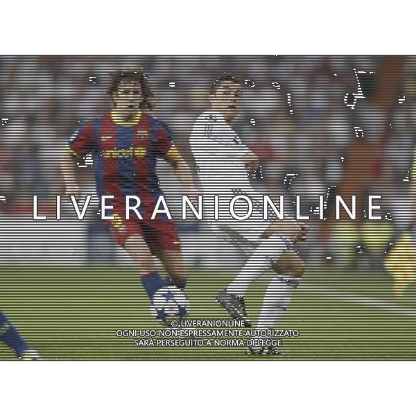 Real Madrid\'s Cristiano Ronaldo against Barcelona\'s Carles Puyol during Champions League match in Madrid. April 27, 2011. (ALTERPHOTOS/Alvaro Hernandez) AG ALDO LIVERANI ONLY ITALY