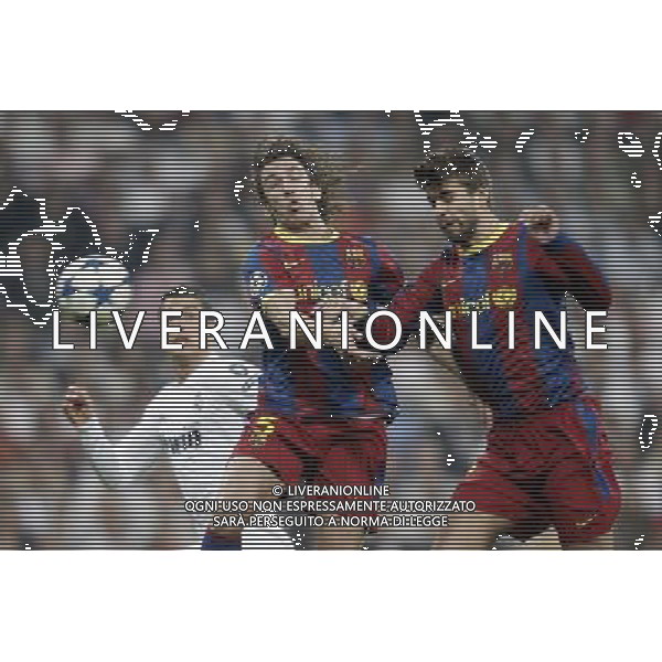 Real Madrid\'s Cristiano Ronaldo against Barcelona\'s Carles Puyol and Gerard Pique during Champions League match in Madrid. April 27, 2011. (ALTERPHOTOS/Alvaro Hernandez) AG ALDO LIVERANI ONLY ITALY