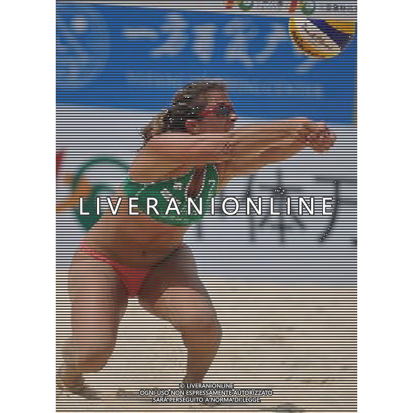 (110428) -- SANYA, April 28, 2011 () -- Misty May-Treanor of the United States saves the ball against Jana Kohler and Julia Sude of Germany during 2011 Swatch FIVB Beach Volleyball World Tour in Sanya, south China\'s Hainan Province, April 28, 2011. The United States won 2-0. (/Hou Jiansen) AG ALDO LIVERANI S A S ONLY ITALY