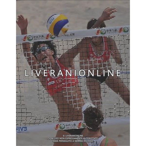 (110428) -- SANYA, April 28, 2011 () -- China\'s Huang Ying (above L) blocks against Giombini Laura and Rosso Valeriathe of Italy during 2011 Swatch FIVB Beach Volleyball World Tour in Sanya, south China\'s Hainan Province, April 28, 2011. China won 2-1. (/Hou Jiansen) AG ALDO LIVERANI S A S ONLY ITALY