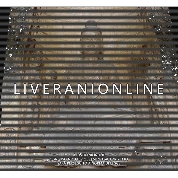 (110428) -- ZHENGZHOU, April 28, 2011 () -- Photo taken on April 28, 2011, shows a statue of Buddha in the Gongyi Grotto Temple in Gongyi City of Zhengzhou, capital of central China\'s Henan Province. The Gongyi Grotto Temple, caved by the royal family of the North Wei Dynasty (386-557), has five existing grottoes and 7,743 Buddha statues. The grotto temple has become a tourist site along the Yellow River after receiving restoration and proper protection. (/Zhao Peng) (llp) Zhengzhou Foto scattata il 28 aprile 2011, mostra due statue di Buddha nella Grotta Gongyi Tempio di Gongyi cittˆ di Zhengzhou, Il tempio grotta  diventata una localitˆ turistica lungo il Fiume Giallo, dopo aver ricevuto il restauro e la protezione adeguata. AG. ALDO LIVERANI SAS ITALY ONLY *** Local Caption *** .