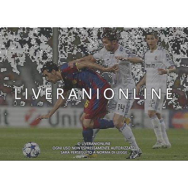 FC Barcelona\'s Sergio Busquets (l) and Real Madrid\'s Xabi Alonso during UEFA Champions League match.May 3,2011.(ALTERPHOTOS/Acero) AG ALDO LIVERANI S A S ONLY ITALKY