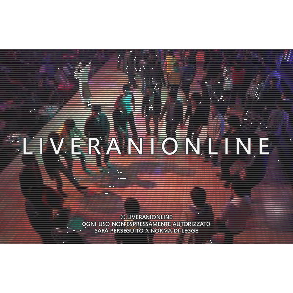 LHASA, May 9, 2011 People participate in \'guozhuang\' dance at the Niwei Langma Hall in Lhasa, capital of southwest China\'s Tibet Autonomous Region, May 6, 2011. It was 10:30 p.m. in Lhasa. Although most of the shops and restaurants were about to close, Niwei Langma hall was just warming up. Colorful spotlights illuminated the huge backdrop painting of the Potala Palace on the stage, while delightful Tibetan melody echoed around the hall. Guests were arriving in pairs or groups and quickly filled up the entertainment place. Dainzhencao, a newcome dancer, was busy dressing herself for the opening performance. She couldn\'t stop feeling nervous until she made sure her make up, costumes and decorations were all done, as she just danced this piece for a few times. However, at another dressing room, the experienced dancers were in an easy mood, as some were playing cell phone games, gossiping, and even knitting. The word \'Langma\' in Tibetan language means courtly performance, which in the past was only an entertainment for Tibetan traditional aristocracy. However, the present langma hall eventually evolved into a place of part bar, part folk concert hall and part ballroom, where common Tibetan people go for relaxation and gathering. Since the first such place opened in the mid 1990s, Langma halls soon became quite popular all over Tibet and emerged one after another in a short time. Today, Niwei is one of the biggest Langma halls in Lhasa. Its owner Gyaebo, who used to be a famous tap dancer in Lhasa, runs four langma halls of his own. All of his langma halls perform traditional Tibetan songs and dances, but in order to cater to different taste of customers, two langma halls emphasize on modern, western dance and even disco, while the others focus on Tibetan \'guozhuang\' and tap dance. There are more than 50 actors in Niwei Langma Hall, more than half of whom are at their 20\'s. They usually work for 5 6 hours per day, and attend two hour long rehears Scene di vita a Lhasa AG. ALDO LIVERANI SAS ITALY ONLY *** Local Caption *** .