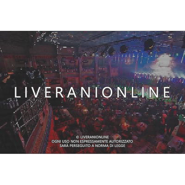 LHASA, May 9, 2011 Photo taken on early May 7, 2011 shows the joyous Niwei Langma Hall in Lhasa, capital of southwest China\'s Tibet Autonomous Region. It was 10:30 p.m. in Lhasa. Although most of the shops and restaurants were about to close, Niwei Langma hall was just warming up. Colorful spotlights illuminated the huge backdrop painting of the Potala Palace on the stage, while delightful Tibetan melody echoed around the hall. Guests were arriving in pairs or groups and quickly filled up the entertainment place. Dainzhencao, a newcome dancer, was busy dressing herself for the opening performance. She couldn\'t stop feeling nervous until she made sure her make up, costumes and decorations were all done, as she just danced this piece for a few times. However, at another dressing room, the experienced dancers were in an easy mood, as some were playing cell phone games, gossiping, and even knitting. The word \'Langma\' in Tibetan language means courtly performance, which in the past was only an entertainment for Tibetan traditional aristocracy. However, the present langma hall eventually evolved into a place of part bar, part folk concert hall and part ballroom, where common Tibetan people go for relaxation and gathering. Since the first such place opened in the mid 1990s, Langma halls soon became quite popular all over Tibet and emerged one after another in a short time. Today, Niwei is one of the biggest Langma halls in Lhasa. Its owner Gyaebo, who used to be a famous tap dancer in Lhasa, runs four langma halls of his own. All of his langma halls perform traditional Tibetan songs and dances, but in order to cater to different taste of customers, two langma halls emphasize on modern, western dance and even disco, while the others focus on Tibetan \'guozhuang\' and tap dance. There are more than 50 actors in Niwei Langma Hall, more than half of whom are at their 20\'s. They usually work for 5 6 hours per day, and attend two hour long rehearsals for 3 4 Scene di vita a Lhasa AG. ALDO LIVERANI SAS ITALY ONLY *** Local Caption *** .