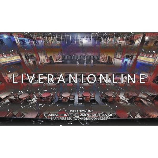 LHASA, May 9, 2011 Three actors rehearse their dance at the Niwei Langma Hall in Lhasa, capital of southwest China\'s Tibet Autonomous Region, in the afternoon of May 6, 2011. It was 10:30 p.m. in Lhasa. Although most of the shops and restaurants were about to close, Niwei Langma hall was just warming up. Colorful spotlights illuminated the huge backdrop painting of the Potala Palace on the stage, while delightful Tibetan melody echoed around the hall. Guests were arriving in pairs or groups and quickly filled up the entertainment place. Dainzhencao, a newcome dancer, was busy dressing herself for the opening performance. She couldn\'t stop feeling nervous until she made sure her make up, costumes and decorations were all done, as she just danced this piece for a few times. However, at another dressing room, the experienced dancers were in an easy mood, as some were playing cell phone games, gossiping, and even knitting. The word \'Langma\' in Tibetan language means courtly performance, which in the past was only an entertainment for Tibetan traditional aristocracy. However, the present langma hall eventually evolved into a place of part bar, part folk concert hall and part ballroom, where common Tibetan people go for relaxation and gathering. Since the first such place opened in the mid 1990s, Langma halls soon became quite popular all over Tibet and emerged one after another in a short time. Today, Niwei is one of the biggest Langma halls in Lhasa. Its owner Gyaebo, who used to be a famous tap dancer in Lhasa, runs four langma halls of his own. All of his langma halls perform traditional Tibetan songs and dances, but in order to cater to different taste of customers, two langma halls emphasize on modern, western dance and even disco, while the others focus on Tibetan \'guozhuang\' and tap dance. There are more than 50 actors in Niwei Langma Hall, more than half of whom are at their 20\'s. They usually work for 5 6 hours per day, and attend two hour Scene di vita a Lhasa AG. ALDO LIVERANI SAS ITALY ONLY *** Local Caption *** .