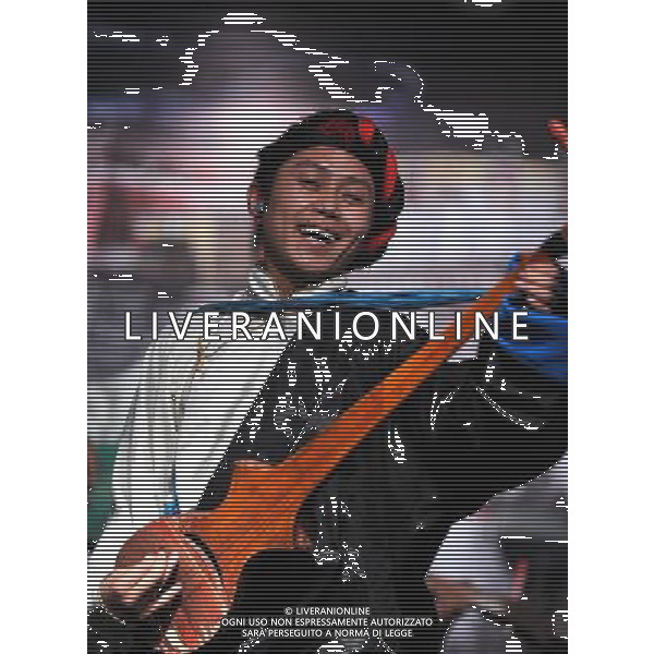 LHASA, May 9, 2011 Actor Zhamdu performs folk dance of Shigatse region at the New Century Langma Hall in Lhasa, capital of southwest China\'s Tibet Autonomous Region, early May 8, 2011. It was 10:30 p.m. in Lhasa. Although most of the shops and restaurants were about to close, Niwei Langma hall was just warming up. Colorful spotlights illuminated the huge backdrop painting of the Potala Palace on the stage, while delightful Tibetan melody echoed around the hall. Guests were arriving in pairs or groups and quickly filled up the entertainment place. Dainzhencao, a newcome dancer, was busy dressing herself for the opening performance. She couldn\'t stop feeling nervous until she made sure her make up, costumes and decorations were all done, as she just danced this piece for a few times. However, at another dressing room, the experienced dancers were in an easy mood, as some were playing cell phone games, gossiping, and even knitting. The word \'Langma\' in Tibetan language means courtly performance, which in the past was only an entertainment for Tibetan traditional aristocracy. However, the present langma hall eventually evolved into a place of part bar, part folk concert hall and part ballroom, where common Tibetan people go for relaxation and gathering. Since the first such place opened in the mid 1990s, Langma halls soon became quite popular all over Tibet and emerged one after another in a short time. Today, Niwei is one of the biggest Langma halls in Lhasa. Its owner Gyaebo, who used to be a famous tap dancer in Lhasa, runs four langma halls of his own. All of his langma halls perform traditional Tibetan songs and dances, but in order to cater to different taste of customers, two langma halls emphasize on modern, western dance and even disco, while the others focus on Tibetan \'guozhuang\' and tap dance. There are more than 50 actors in Niwei Langma Hall, more than half of whom are at their 20\'s. They usually work for 5 6 hours per day, and atten Scene di vita a Lhasa AG. ALDO LIVERANI SAS ITALY ONLY *** Local Caption *** .