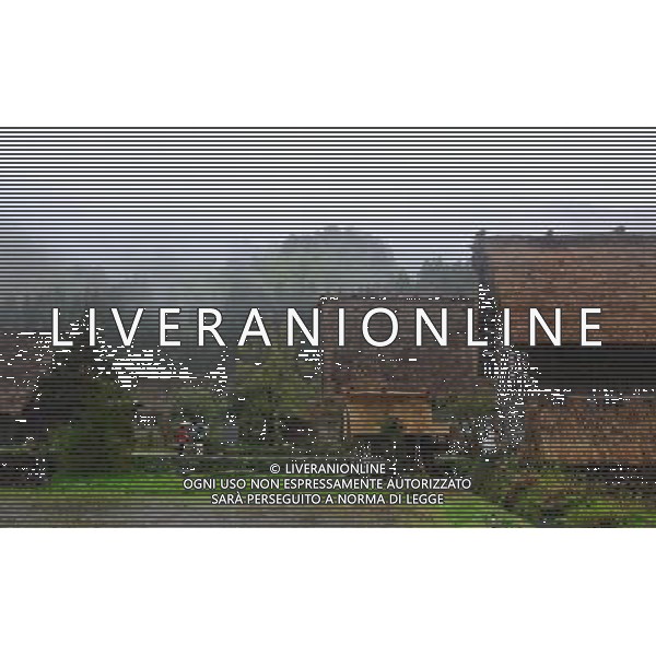 GIFU, May 10, 2011 Tourists visit the gassho zukuri village in Shirakawa go, Gifu Prefecture, Japan, May 10, 2011. Gassho zukuri village in Shirakawa go is one of Japan\'s UNESCO World Heritage Sites. The village is well known for its houses constructed in architectural style known as gassho zukuri, which means prayer hands construction. This style is characterized by a thatched and steeply slanting roof resembling two hands joined in prayer. The design is strong and, in combination with the unique properties of the thatching, allow the houses to withstand and shed the weight of the region\'s heavy snowfalls in winter.(/Ji Chunpeng) (msq) Gifu le case di un villaggio gassho zukuri in Shirakawa , Prefettura di Gifu, in Giappone. Villaggio Gassho zukuri in Shirakawa Go  stato dichiarato dall\'UNESCO Patrimonio dell\'Umanitˆ AG.ALDO LIVERANI SAS ITALY ONLY *** Local Caption *** .