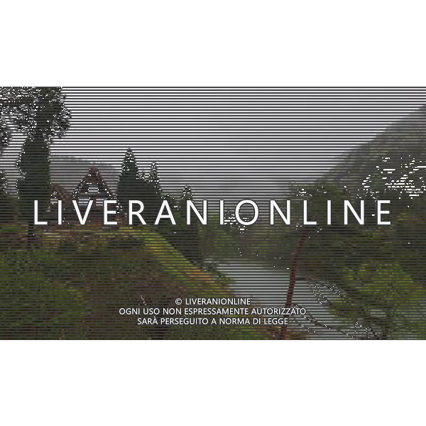 GIFU, May 10, 2011 This photo taken on May 10, 2011 shows the houses of a gassho zukuri village in Shirakawa go, Gifu Prefecture, Japan. Gassho zukuri village in Shirakawa go is one of Japan\'s UNESCO World Heritage Sites. The village is well known for its houses constructed in architectural style known as gassho zukuri, which means prayer hands construction. This style is characterized by a thatched and steeply slanting roof resembling two hands joined in prayer. The design is strong and, in combination with the unique properties of the thatching, allow the houses to withstand and shed the weight of the region\'s heavy snowfalls in winter.(/Ji Chunpeng) (msq) Gifu le case di un villaggio gassho zukuri in Shirakawa , Prefettura di Gifu, in Giappone. Villaggio Gassho zukuri in Shirakawa Go  stato dichiarato dall\'UNESCO Patrimonio dell\'Umanitˆ AG.ALDO LIVERANI SAS ITALY ONLY *** Local Caption *** .