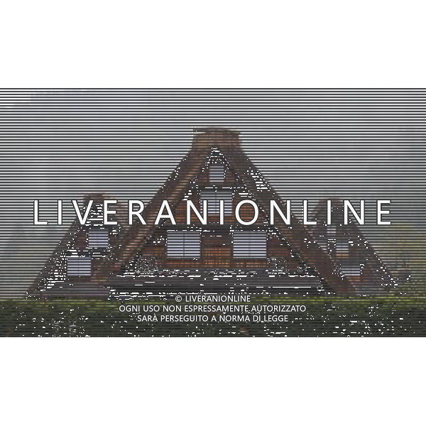 GIFU, May 10, 2011 This photo taken on May 10, 2011 shows the houses of a gassho zukuri village in Shirakawa go, Gifu Prefecture, Japan. Gassho zukuri village in Shirakawa go is one of Japan\'s UNESCO World Heritage Sites. The village is well known for its houses constructed in architectural style known as gassho zukuri, which means prayer hands construction. This style is characterized by a thatched and steeply slanting roof resembling two hands joined in prayer. The design is strong and, in combination with the unique properties of the thatching, allow the houses to withstand and shed the weight of the region\'s heavy snowfalls in winter.(/Ji Chunpeng) (msq) Gifu le case di un villaggio gassho zukuri in Shirakawa , Prefettura di Gifu, in Giappone. Villaggio Gassho zukuri in Shirakawa Go  stato dichiarato dall\'UNESCO Patrimonio dell\'Umanitˆ AG.ALDO LIVERANI SAS ITALY ONLY *** Local Caption *** .