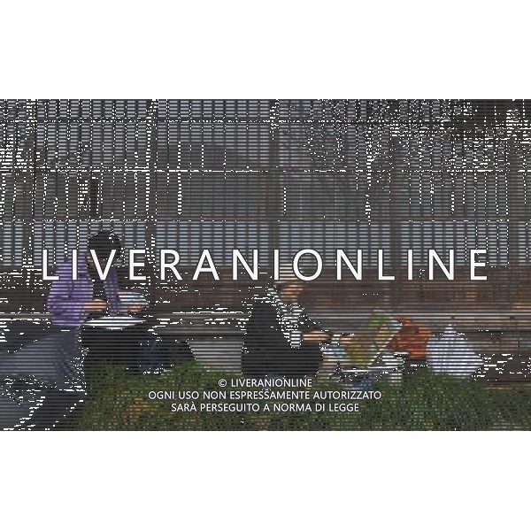 GIFU, May 10, 2011 Tourists draw pictures at the gassho zukuri village in Shirakawa go, Gifu Prefecture, Japan, May 10, 2011. Gassho zukuri village in Shirakawa go is one of Japan\'s UNESCO World Heritage Sites. The village is well known for its houses constructed in architectural style known as gassho zukuri, which means prayer hands construction. This style is characterized by a thatched and steeply slanting roof resembling two hands joined in prayer. The design is strong and, in combination with the unique properties of the thatching, allow the houses to withstand and shed the weight of the region\'s heavy snowfalls in winter.(/Ji Chunpeng) (msq) Gifu le case di un villaggio gassho zukuri in Shirakawa , Prefettura di Gifu, in Giappone. Villaggio Gassho zukuri in Shirakawa Go  stato dichiarato dall\'UNESCO Patrimonio dell\'Umanitˆ AG.ALDO LIVERANI SAS ITALY ONLY *** Local Caption *** .