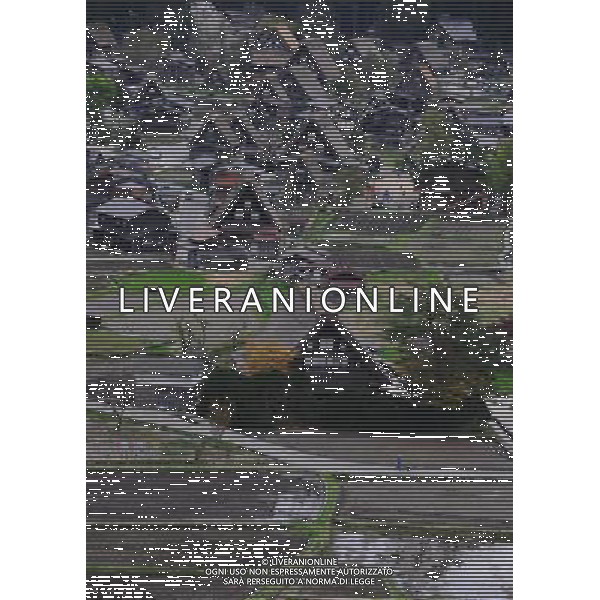 GIFU, May 10, 2011 This photo taken on May 9, 2011 shows the houses of a gassho zukuri village in Shirakawa go, Gifu Prefecture, Japan. Gassho zukuri village in Shirakawa go is one of Japan\'s UNESCO World Heritage Sites. The village is well known for its houses constructed in architectural style known as gassho zukuri, which means prayer hands construction. This style is characterized by a thatched and steeply slanting roof resembling two hands joined in prayer. The design is strong and, in combination with the unique properties of the thatching, allow the houses to withstand and shed the weight of the region\'s heavy snowfalls in winter.(/Ji Chunpeng) (msq) Gifu le case di un villaggio gassho zukuri in Shirakawa , Prefettura di Gifu, in Giappone. Villaggio Gassho zukuri in Shirakawa Go  stato dichiarato dall\'UNESCO Patrimonio dell\'Umanitˆ AG.ALDO LIVERANI SAS ITALY ONLY *** Local Caption *** .