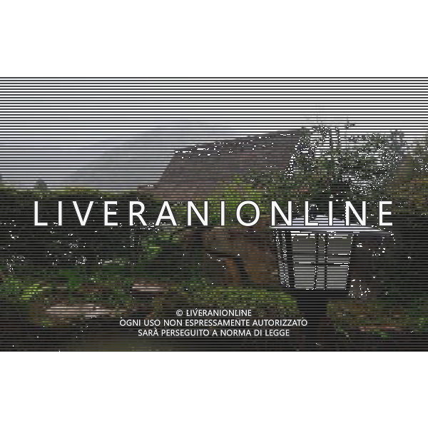 GIFU, May 10, 2011 This photo taken on May 10, 2011 shows a house of a gassho zukuri village in Shirakawa go, Gifu Prefecture, Japan. Gassho zukuri village in Shirakawa go is one of Japan\'s UNESCO World Heritage Sites. The village is well known for its houses constructed in architectural style known as gassho zukuri, which means prayer hands construction. This style is characterized by a thatched and steeply slanting roof resembling two hands joined in prayer. The design is strong and, in combination with the unique properties of the thatching, allow the houses to withstand and shed the weight of the region\'s heavy snowfalls in winter.(/Ji Chunpeng) (msq) Gifu le case di un villaggio gassho zukuri in Shirakawa , Prefettura di Gifu, in Giappone. Villaggio Gassho zukuri in Shirakawa Go  stato dichiarato dall\'UNESCO Patrimonio dell\'Umanitˆ AG.ALDO LIVERANI SAS ITALY ONLY *** Local Caption *** .