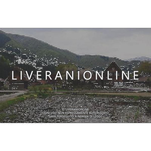 GIFU, May 10, 2011 This photo taken on May 9, 2011 shows the houses of a gassho zukuri village in Shirakawa go, Gifu Prefecture, Japan. Gassho zukuri village in Shirakawa go is one of Japan\'s UNESCO World Heritage Sites. The village is well known for its houses constructed in architectural style known as gassho zukuri, which means prayer hands construction. This style is characterized by a thatched and steeply slanting roof resembling two hands joined in prayer. The design is strong and, in combination with the unique properties of the thatching, allow the houses to withstand and shed the weight of the region\'s heavy snowfalls in winter.(/Ji Chunpeng) (msq) Gifu le case di un villaggio gassho zukuri in Shirakawa , Prefettura di Gifu, in Giappone. Villaggio Gassho zukuri in Shirakawa Go  stato dichiarato dall\'UNESCO Patrimonio dell\'Umanitˆ AG.ALDO LIVERANI SAS ITALY ONLY *** Local Caption *** .