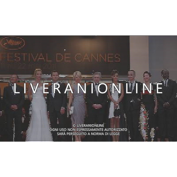 (110511) -- CANNES, May 11, 2011 () -- Jury President Robert De Niro (C) and jury members Johnnie To, Uma Thurman, Jude Law, Linn Ullmann, Martina Gusman, Olivier Assayas, Nansun Shi and Mahamat Saleh Haroun (L-R) pose before the opening of the 64th Cannes Film Festival in Cannes, France, on May 11, 2011. (/Gao Jing) /PHOTOSHOT/ALDO LIVERANI SAS - ITALY ONLY - *** Local Caption *** .