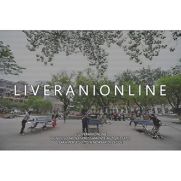 TIANJIN, May 10, 2011 Citizens play table tennis in a garden at Tai\'an Road in Tianjin Municipality, north China, May 9, 2011. Located in the middle of original British concession, Tai\'an road has more than 100 years history, with The Astor Hotel, Victoria Garden and Anglican Church sitting along it. A district with British characters has taken shape after three buildings was basically completed in the Taian Road in Tianjin. (/Qiu Yuewei)(yrz) Citta\' di Tianjin , scorcio con vista sui pricipali monumenti ed edifici storici AG. ALDO LIVERANI SAS ITALY ONLY *** Local Caption *** .