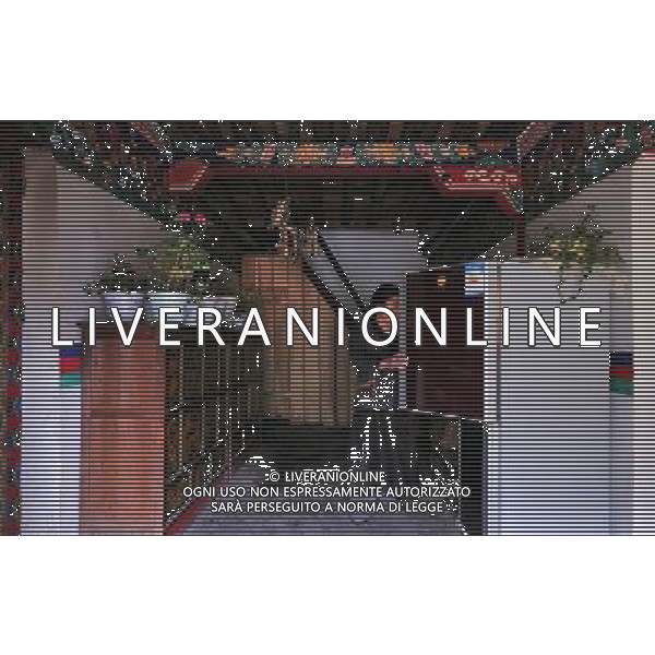 (110517) -- BEIJING, May 17, 2011 () -- Ya Niang, a villager of Lhoba ethnic group, picks food from a refrigerator at home in Qionglin Village of Nanyi Lhoba Ethnic Township, in Mainling County of southwest China\'s Tibet Autonomous Region (TAR), May 12, 2011. Located at the foot of snow-peaked mountains near the south border between China and India, the Nanyi Township of Qionglin Village, a tranquil and picturesque place, is inhabited by people of Lhoba ethnic group. With a total of 2900 people, Lhoba ethnic group is the smallest among China\'s 56 ethnic groups in term of population. The family of forty-six-year-old Ma Ya is one of the 30 Lhoba households in the village. They live in a two-storeyed house with many modern devices like television, washing machine, refrigerator, etc. In 2008, his family opened a household inn when Qionglin Village set up a scenic area. Their family inn soon went popular among tourists, and earned them about 6,000 yuan (922 U. S. dollars) per month at the tourism peak season from June to October. Yet just 50 years ago, before Ma Ya\'s birth, his father and grandfather still lived in the wood, depending mainly on hunting with bows and arrows, in the very form of a primitive society. As few knew their existence in the wildest nature, they were dubbed as \'the tribe of mystery\'. In the 1960s, after the peaceful liberation of Tibet, Ma Ya\'s father and some other Lhoba people moved out of the wood and settled on a land offered by the local government. By 1985, all the Lhoba people of the village have moved into free dwelling houses and started to breed livestock provided by the government, thus marking the brand-new start of their modern life. Instead of hunting and logging, their previous livelihood, local villagers of Lhoba now earn their living on stockbreeding, bamboo weaving, herbal medicine picking, and tourism. Under the benefits of many national policies preferential for minority groups, the annual income per capita of N Situato ai piedi delle montagne innevate, vicino al confine meridionale tra la Cina e l\'India, il Comune di Nanyi Qionglin Village, un luogo pittoresco e tranquillo, abitato da persone del gruppo etnico Lhoba. Con un totale di 2900 persone, il gruppo etnico Lhoba  il pi piccolo dei 56 gruppi etnici in termini di popolazione in Cina Etnie - Vita - Rurali - AG. ALDO LIVERANI SAS ITALY ONLY *** Local Caption *** .