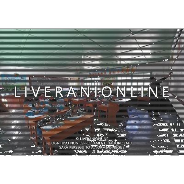 (110517) -- BEIJING, May 17, 2011 () -- Pupils have a class at a Lhoba primary school in Nanyi Lhoba Ethnic Township, in Mainling County of southwest China\'s Tibet Autonomous Region (TAR), May 11, 2011. Located at the foot of snow-peaked mountains near the south border between China and India, the Nanyi Township of Qionglin Village, a tranquil and picturesque place, is inhabited by people of Lhoba ethnic group. With a total of 2900 people, Lhoba ethnic group is the smallest among China\'s 56 ethnic groups in term of population. The family of forty-six-year-old Ma Ya is one of the 30 Lhoba households in the village. They live in a two-storeyed house with many modern devices like television, washing machine, refrigerator, etc. In 2008, his family opened a household inn when Qionglin Village set up a scenic area. Their family inn soon went popular among tourists, and earned them about 6,000 yuan (922 U. S. dollars) per month at the tourism peak season from June to October. Yet just 50 years ago, before Ma Ya\'s birth, his father and grandfather still lived in the wood, depending mainly on hunting with bows and arrows, in the very form of a primitive society. As few knew their existence in the wildest nature, they were dubbed as \'the tribe of mystery\'. In the 1960s, after the peaceful liberation of Tibet, Ma Ya\'s father and some other Lhoba people moved out of the wood and settled on a land offered by the local government. By 1985, all the Lhoba people of the village have moved into free dwelling houses and started to breed livestock provided by the government, thus marking the brand-new start of their modern life. Instead of hunting and logging, their previous livelihood, local villagers of Lhoba now earn their living on stockbreeding, bamboo weaving, herbal medicine picking, and tourism. Under the benefits of many national policies preferential for minority groups, the annual income per capita of Nanyi Township reached 5760 yuan (885 U.S. dollars) in 201 Situato ai piedi delle montagne innevate, vicino al confine meridionale tra la Cina e l\'India, il Comune di Nanyi Qionglin Village, un luogo pittoresco e tranquillo, abitato da persone del gruppo etnico Lhoba. Con un totale di 2900 persone, il gruppo etnico Lhoba  il pi piccolo dei 56 gruppi etnici in termini di popolazione in Cina Etnie - Vita - Rurali - AG. ALDO LIVERANI SAS ITALY ONLY *** Local Caption *** .