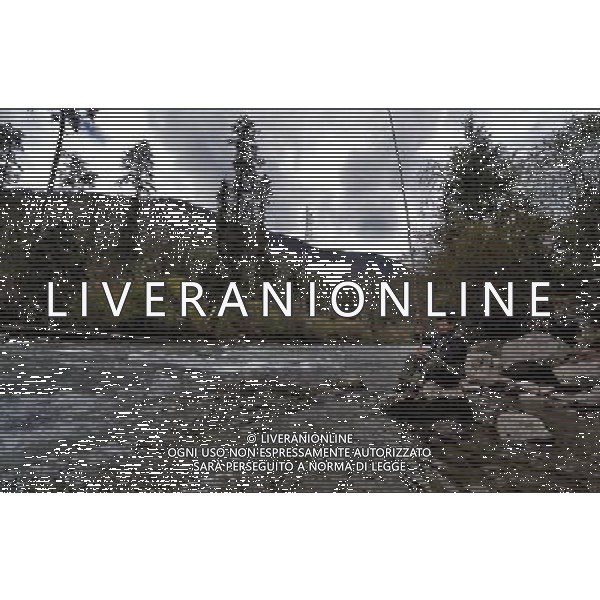 (110517) -- BEIJING, May 17, 2011 () -- Da Yao, a villager of Lhoba ethnic group, angles fish by a river in Qionglin Village of Nanyi Lhoba Ethnic Township, in Mainling County of southwest China\'s Tibet Autonomous Region (TAR), May 11, 2011. Located at the foot of snow-peaked mountains near the south border between China and India, the Nanyi Township of Qionglin Village, a tranquil and picturesque place, is inhabited by people of Lhoba ethnic group. With a total of 2900 people, Lhoba ethnic group is the smallest among China\'s 56 ethnic groups in term of population. The family of forty-six-year-old Ma Ya is one of the 30 Lhoba households in the village. They live in a two-storeyed house with many modern devices like television, washing machine, refrigerator, etc. In 2008, his family opened a household inn when Qionglin Village set up a scenic area. Their family inn soon went popular among tourists, and earned them about 6,000 yuan (922 U. S. dollars) per month at the tourism peak season from June to October. Yet just 50 years ago, before Ma Ya\'s birth, his father and grandfather still lived in the wood, depending mainly on hunting with bows and arrows, in the very form of a primitive society. As few knew their existence in the wildest nature, they were dubbed as \'the tribe of mystery\'. In the 1960s, after the peaceful liberation of Tibet, Ma Ya\'s father and some other Lhoba people moved out of the wood and settled on a land offered by the local government. By 1985, all the Lhoba people of the village have moved into free dwelling houses and started to breed livestock provided by the government, thus marking the brand-new start of their modern life. Instead of hunting and logging, their previous livelihood, local villagers of Lhoba now earn their living on stockbreeding, bamboo weaving, herbal medicine picking, and tourism. Under the benefits of many national policies preferential for minority groups, the annual income per capita of Nanyi Township reac Situato ai piedi delle montagne innevate, vicino al confine meridionale tra la Cina e l\'India, il Comune di Nanyi Qionglin Village, un luogo pittoresco e tranquillo, abitato da persone del gruppo etnico Lhoba. Con un totale di 2900 persone, il gruppo etnico Lhoba  il pi piccolo dei 56 gruppi etnici in termini di popolazione in Cina Etnie - Vita - Rurali - AG. ALDO LIVERANI SAS ITALY ONLY *** Local Caption *** .