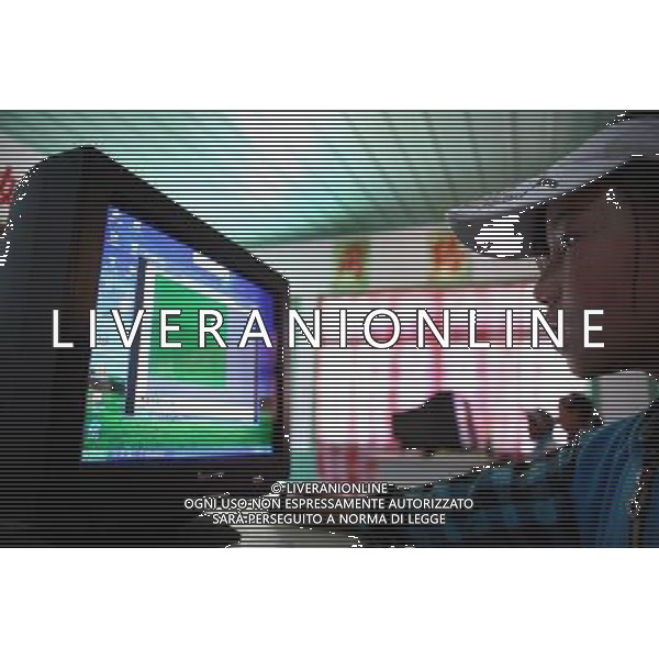 (110517) -- BEIJING, May 17, 2011 () -- Zhaxizhoima, a pupil of Lhoba ethnic group, has computer class at school in Qionglin Village of Nanyi Lhoba Ethnic Township, in Mainling County of southwest China\'s Tibet Autonomous Region (TAR), May 11, 2011. She said this class is her favorite one, because she can learn how to send an email to her sister who studies in Beijing. Located at the foot of snow-peaked mountains near the south border between China and India, the Nanyi Township of Qionglin Village, a tranquil and picturesque place, is inhabited by people of Lhoba ethnic group. With a total of 2900 people, Lhoba ethnic group is the smallest among China\'s 56 ethnic groups in term of population. The family of forty-six-year-old Ma Ya is one of the 30 Lhoba households in the village. They live in a two-storeyed house with many modern devices like television, washing machine, refrigerator, etc. In 2008, his family opened a household inn when Qionglin Village set up a scenic area. Their family inn soon went popular among tourists, and earned them about 6,000 yuan (922 U. S. dollars) per month at the tourism peak season from June to October. Yet just 50 years ago, before Ma Ya\'s birth, his father and grandfather still lived in the wood, depending mainly on hunting with bows and arrows, in the very form of a primitive society. As few knew their existence in the wildest nature, they were dubbed as \'the tribe of mystery\'. In the 1960s, after the peaceful liberation of Tibet, Ma Ya\'s father and some other Lhoba people moved out of the wood and settled on a land offered by the local government. By 1985, all the Lhoba people of the village have moved into free dwelling houses and started to breed livestock provided by the government, thus marking the brand-new start of their modern life. Instead of hunting and logging, their previous livelihood, local villagers of Lhoba now earn their living on stockbreeding, bamboo weaving, herbal medicine picking, and tourism. U Situato ai piedi delle montagne innevate, vicino al confine meridionale tra la Cina e l\'India, il Comune di Nanyi Qionglin Village, un luogo pittoresco e tranquillo, abitato da persone del gruppo etnico Lhoba. Con un totale di 2900 persone, il gruppo etnico Lhoba  il pi piccolo dei 56 gruppi etnici in termini di popolazione in Cina Etnie - Vita - Rurali - AG. ALDO LIVERANI SAS ITALY ONLY *** Local Caption *** .