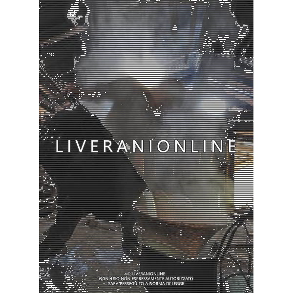 (110517) -- BEIJING, May 17, 2011 () -- Da Yao, a villager of Lhoba ethnic group, makes milk products at a shed in Qionglin Village of Nanyi Lhoba Ethnic Township, in Mainling County of southwest China\'s Tibet Autonomous Region (TAR), May 11, 2011. Located at the foot of snow-peaked mountains near the south border between China and India, the Nanyi Township of Qionglin Village, a tranquil and picturesque place, is inhabited by people of Lhoba ethnic group. With a total of 2900 people, Lhoba ethnic group is the smallest among China\'s 56 ethnic groups in term of population. The family of forty-six-year-old Ma Ya is one of the 30 Lhoba households in the village. They live in a two-storeyed house with many modern devices like television, washing machine, refrigerator, etc. In 2008, his family opened a household inn when Qionglin Village set up a scenic area. Their family inn soon went popular among tourists, and earned them about 6,000 yuan (922 U. S. dollars) per month at the tourism peak season from June to October. Yet just 50 years ago, before Ma Ya\'s birth, his father and grandfather still lived in the wood, depending mainly on hunting with bows and arrows, in the very form of a primitive society. As few knew their existence in the wildest nature, they were dubbed as \'the tribe of mystery\'. In the 1960s, after the peaceful liberation of Tibet, Ma Ya\'s father and some other Lhoba people moved out of the wood and settled on a land offered by the local government. By 1985, all the Lhoba people of the village have moved into free dwelling houses and started to breed livestock provided by the government, thus marking the brand-new start of their modern life. Instead of hunting and logging, their previous livelihood, local villagers of Lhoba now earn their living on stockbreeding, bamboo weaving, herbal medicine picking, and tourism. Under the benefits of many national policies preferential for minority groups, the annual income per capita of Nanyi Townsh Situato ai piedi delle montagne innevate, vicino al confine meridionale tra la Cina e l\'India, il Comune di Nanyi Qionglin Village, un luogo pittoresco e tranquillo, abitato da persone del gruppo etnico Lhoba. Con un totale di 2900 persone, il gruppo etnico Lhoba  il pi piccolo dei 56 gruppi etnici in termini di popolazione in Cina Etnie - Vita - Rurali - AG. ALDO LIVERANI SAS ITALY ONLY *** Local Caption *** .