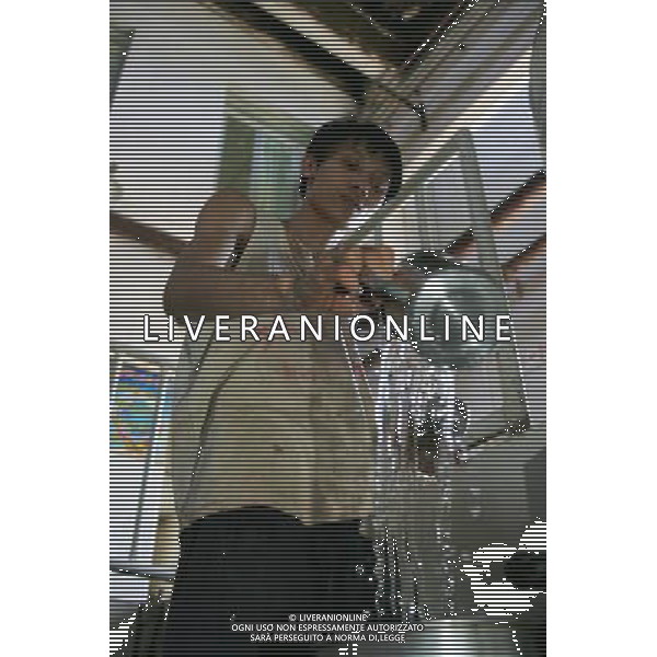 RENHUAI, May 26, 2011 A worker pours liquor into a container at a plant of Moutai Co. Ltd. in Maotai Township of Renhuai, southwest China\'s Guizhou Province, May 17, 2011. Maotai is a small town in Renhuai City of Zunyi, southwest China\'s Guizhou Province. Liquor making can be dated back to 2,000 years ago in the small town. There are many anecdotes about the liquor. During the Long March, the Chinese Red Army passed through Maotai Town in 1935, and used the hard liquor to treat the wounds of soldiers. In January 1935, an enlarged meeting of the Political Bureau of the Communist Party of China (CPC) Central Committee was held in Zunyi, the place where Mao Zedong established his authority within the military, marking a turning point for the CPC and paving the way for the success of China\'s revolution. With deep affection to the liquor, Chinese leaders honored Moutai as the national liquor after the founding of the People\'s Republic of China. Moutai liquor was officially used to feast foreign heads of state and distinguished guests visiting China, and was the only alcohol given as official gifts by Chinese embassies in foreign countries. It is said that former U.S. President Richard Nixon was fascinated by Moutai liquor when he visited China in 1972. As China moves from a planned to a market economy, the Moutai brewery has developed into one of China\'s handful of leading liquor producers with conspicuous achievements in modern corporate management and construction of factory facilities. In 2010, the annual output of Moutai liquor topped 26,000 tons. However, the market supply and demand of the liquor is imbalanced because of its special manufacturing techniques. Prices of the liquor range from 1,000 RMB yuan (about 154 U.S. dollars) to more than 10,000 RMB yuan (about 1,541 U.S. dollars) per bottle. In April, a bottle of vintage Moutai was sold for 8.9 million RMB yuan (about 1.37 million U.S. dollars) at an auction in Guizhou, while the price of Moutai liq