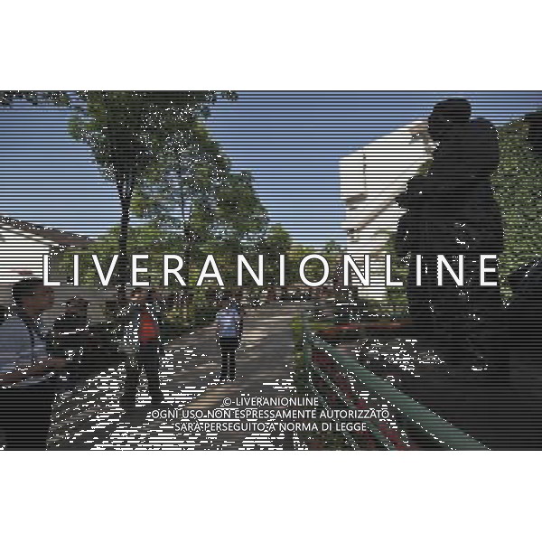 RENHUAI, May 26, 2011 People view sculptures about the Red Army crossing the Chishui River in 1935 at the liquor culture city of Moutai Co. Ltd. in Maotai Township of Renhuai, southwest China\'s Guizhou Province, May 17, 2011. Maotai is a small town in Renhuai City of Zunyi, southwest China\'s Guizhou Province. Liquor making can be dated back to 2,000 years ago in the small town. There are many anecdotes about the liquor. During the Long March, the Chinese Red Army passed through Maotai Town in 1935, and used the hard liquor to treat the wounds of soldiers. In January 1935, an enlarged meeting of the Political Bureau of the Communist Party of China (CPC) Central Committee was held in Zunyi, the place where Mao Zedong established his authority within the military, marking a turning point for the CPC and paving the way for the success of China\'s revolution. With deep affection to the liquor, Chinese leaders honored Moutai as the national liquor after the founding of the People\'s Republic of China. Moutai liquor was officially used to feast foreign heads of state and distinguished guests visiting China, and was the only alcohol given as official gifts by Chinese embassies in foreign countries. It is said that former U.S. President Richard Nixon was fascinated by Moutai liquor when he visited China in 1972. As China moves from a planned to a market economy, the Moutai brewery has developed into one of China\'s handful of leading liquor producers with conspicuous achievements in modern corporate management and construction of factory facilities. In 2010, the annual output of Moutai liquor topped 26,000 tons. However, the market supply and demand of the liquor is imbalanced because of its special manufacturing techniques. Prices of the liquor range from 1,000 RMB yuan (about 154 U.S. dollars) to more than 10,000 RMB yuan (about 1,541 U.S. dollars) per bottle. In April, a bottle of vintage Moutai was sold for 8.9 million RMB yuan (about 1.37 million U.S. dollars) at