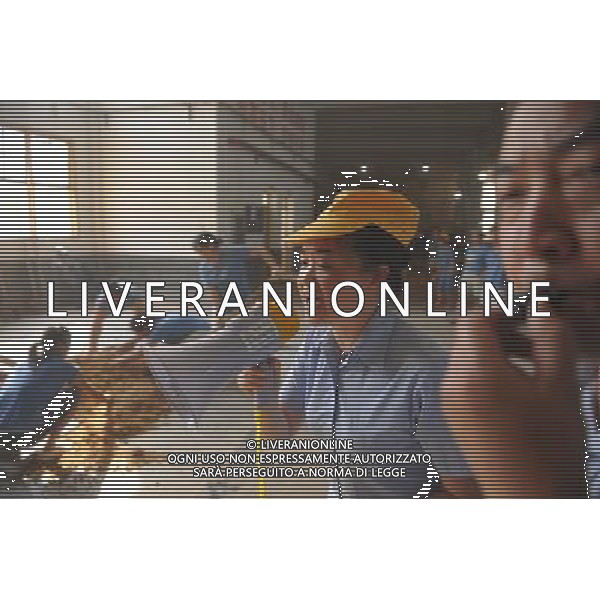 RENHUAI, May 26, 2011 Wang Xirong (2nd R), daughter of the 76 year old Moutai retired worker Hu Shixian, encourages workers during a manufacturing contest at a plant of Moutai Co. Ltd. in Maotai Township of Renhuai, southwest China\'s Guizhou Province, May 18, 2011. A total of 19 members of Hu\'s family have worked in the distillery. Maotai is a small town in Renhuai City of Zunyi, southwest China\'s Guizhou Province. Liquor making can be dated back to 2,000 years ago in the small town. There are many anecdotes about the liquor. During the Long March, the Chinese Red Army passed through Maotai Town in 1935, and used the hard liquor to treat the wounds of soldiers. In January 1935, an enlarged meeting of the Political Bureau of the Communist Party of China (CPC) Central Committee was held in Zunyi, the place where Mao Zedong established his authority within the military, marking a turning point for the CPC and paving the way for the success of China\'s revolution. With deep affection to the liquor, Chinese leaders honored Moutai as the national liquor after the founding of the People\'s Republic of China. Moutai liquor was officially used to feast foreign heads of state and distinguished guests visiting China, and was the only alcohol given as official gifts by Chinese embassies in foreign countries. It is said that former U.S. President Richard Nixon was fascinated by Moutai liquor when he visited China in 1972. As China moves from a planned to a market economy, the Moutai brewery has developed into one of China\'s handful of leading liquor producers with conspicuous achievements in modern corporate management and construction of factory facilities. In 2010, the annual output of Moutai liquor topped 26,000 tons. However, the market supply and demand of the liquor is imbalanced because of its special manufacturing techniques. Prices of the liquor range from 1,000 RMB yuan (about 154 U.S. dollars) to more than 10,000 RMB yuan (about 1,541 U.S. dollars) per bottle.