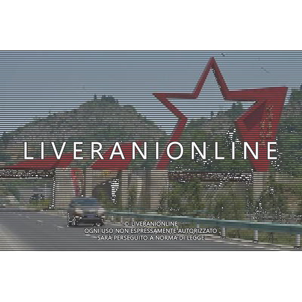 RENHUAI, May 26, 2011 A car runs past a sculpture about the Red Army crossing the Chishui River in 1935 on an expressway linking Renhuai and Zunyi, southwest China\'s Guizhou Province, May 19, 2011. Maotai is a small town in Renhuai City of Zunyi, southwest China\'s Guizhou Province. Liquor making can be dated back to 2,000 years ago in the small town. There are many anecdotes about the liquor. During the Long March, the Chinese Red Army passed through Maotai Town in 1935, and used the hard liquor to treat the wounds of soldiers. In January 1935, an enlarged meeting of the Political Bureau of the Communist Party of China (CPC) Central Committee was held in Zunyi, the place where Mao Zedong established his authority within the military, marking a turning point for the CPC and paving the way for the success of China\'s revolution. With deep affection to the liquor, Chinese leaders honored Moutai as the national liquor after the founding of the People\'s Republic of China. Moutai liquor was officially used to feast foreign heads of state and distinguished guests visiting China, and was the only alcohol given as official gifts by Chinese embassies in foreign countries. It is said that former U.S. President Richard Nixon was fascinated by Moutai liquor when he visited China in 1972. As China moves from a planned to a market economy, the Moutai brewery has developed into one of China\'s handful of leading liquor producers with conspicuous achievements in modern corporate management and construction of factory facilities. In 2010, the annual output of Moutai liquor topped 26,000 tons. However, the market supply and demand of the liquor is imbalanced because of its special manufacturing techniques. Prices of the liquor range from 1,000 RMB yuan (about 154 U.S. dollars) to more than 10,000 RMB yuan (about 1,541 U.S. dollars) per bottle. In April, a bottle of vintage Moutai was sold for 8.9 million RMB yuan (about 1.37 million U.S. dollars) at an auction in Guizhou, while