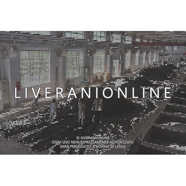 RENHUAI, May 26, 2011 Workers are seen at a plant of Moutai Co. Ltd. in Maotai Township of Renhuai, southwest China\'s Guizhou Province, May 17, 2011. Maotai is a small town in Renhuai City of Zunyi, southwest China\'s Guizhou Province. Liquor making can be dated back to 2,000 years ago in the small town. There are many anecdotes about the liquor. During the Long March, the Chinese Red Army passed through Maotai Town in 1935, and used the hard liquor to treat the wounds of soldiers. In January 1935, an enlarged meeting of the Political Bureau of the Communist Party of China (CPC) Central Committee was held in Zunyi, the place where Mao Zedong established his authority within the military, marking a turning point for the CPC and paving the way for the success of China\'s revolution. With deep affection to the liquor, Chinese leaders honored Moutai as the national liquor after the founding of the People\'s Republic of China. Moutai liquor was officially used to feast foreign heads of state and distinguished guests visiting China, and was the only alcohol given as official gifts by Chinese embassies in foreign countries. It is said that former U.S. President Richard Nixon was fascinated by Moutai liquor when he visited China in 1972. As China moves from a planned to a market economy, the Moutai brewery has developed into one of China\'s handful of leading liquor producers with conspicuous achievements in modern corporate management and construction of factory facilities. In 2010, the annual output of Moutai liquor topped 26,000 tons. However, the market supply and demand of the liquor is imbalanced because of its special manufacturing techniques. Prices of the liquor range from 1,000 RMB yuan (about 154 U.S. dollars) to more than 10,000 RMB yuan (about 1,541 U.S. dollars) per bottle. In April, a bottle of vintage Moutai was sold for 8.9 million RMB yuan (about 1.37 million U.S. dollars) at an auction in Guizhou, while the price of Moutai liquor was less than 10 RMB