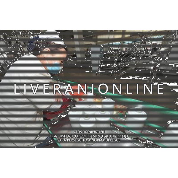 (110526) -- RENHUAI, May 26, 2011 () -- A worker examines liquor products at a plant of Moutai Co. Ltd. in Maotai Township of Renhuai, southwest China\'s Guizhou Province, May 18, 2011. Maotai is a small town in Renhuai City of Zunyi, southwest China\'s Guizhou Province. Liquor-making can be dated back to 2,000 years ago in the small town. There are many anecdotes about the liquor. During the Long March, the Chinese Red Army passed through Maotai Town in 1935, and used the hard liquor to treat the wounds of soldiers. In January 1935, an enlarged meeting of the Political Bureau of the Communist Party of China (CPC) Central Committee was held in Zunyi, the place where Mao Zedong established his authority within the military, marking a turning point for the CPC and paving the way for the success of China\'s revolution. With deep affection to the liquor, Chinese leaders honored Moutai as the national liquor after the founding of the People\'s Republic of China. Moutai liquor was officially used to feast foreign heads of state and distinguished guests visiting China, and was the only alcohol given as official gifts by Chinese embassies in foreign countries. It is said that former U.S. President Richard Nixon was fascinated by Moutai liquor when he visited China in 1972. As China moves from a planned to a market economy, the Moutai brewery has developed into one of China\'s handful of leading liquor producers with conspicuous achievements in modern corporate management and construction of factory facilities. In 2010, the annual output of Moutai liquor topped 26,000 tons. However, the market supply and demand of the liquor is imbalanced because of its special manufacturing techniques. Prices of the liquor range from 1,000 RMB yuan (about 154 U.S. dollars) to more than 10,000 RMB yuan (about 1,541 U.S. dollars) per bottle. In April, a bottle of vintage Moutai was sold for 8.9 million RMB yuan (about 1.37 million U.S. dollars) at an auction in Guizhou, while the price of