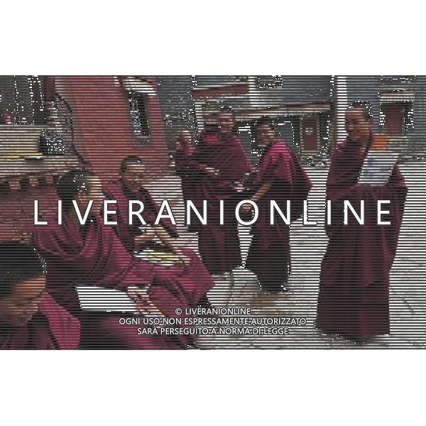 (110526) -- SAGYA, May 26, 2011 () -- Monks are seen in Sagya Monastery in Sagya County, southwest China\'s Tibet Autonomous Region, May 19, 2011. Sagya Monastery, a monastery of Sagayapa sect of Tibetan Buddhism, is known for housing numerous classical books on Buddhism and precious paintings. It was built in 1073 on the gray clay hill on the northern bank of the Chun Qu River in Sagya County, 149 kilometers from Xigaze Prefecture, and designed in a combined architectural style of China\'s Tibetan, Mogolian and Han ethnic groups. The monastery has been repaired and renovated from June 2002 to August 2009, sponsored by the governmental fund of more than 90 million yuan (13.85 million USD). (/Tao Xiyi) (zn) Il Tempio Tibetano Buddista di Sagya nella regione autonoma del Tibet AG. ALDO LIVERANI SAS ITYALY ONLY *** Local Caption *** .