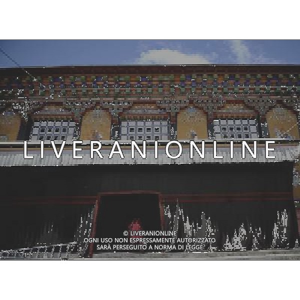 (110526) -- SAGYA, May 26, 2011 () -- A monk walks into a temple hall in Sagya Monastery in Sagya County, southwest China\'s Tibet Autonomous Region, May 19, 2011. Sagya Monastery, a monastery of Sagayapa sect of Tibetan Buddhism, is known for housing numerous classical books on Buddhism and precious paintings. It was built in 1073 on the gray clay hill on the northern bank of the Chun Qu River in Sagya County, 149 kilometers from Xigaze Prefecture, and designed in a combined architectural style of China\'s Tibetan, Mogolian and Han ethnic groups. The monastery has been repaired and renovated from June 2002 to August 2009, sponsored by the governmental fund of more than 90 million yuan (13.85 million USD). (/Purbu Zhaxi) (zn) Il Tempio Tibetano Buddista di Sagya nella regione autonoma del Tibet AG. ALDO LIVERANI SAS ITYALY ONLY *** Local Caption *** .