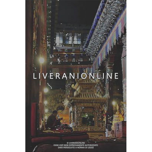 (110526) -- SAGYA, May 26, 2011 () -- A monk sits in the main temple hall in Sagya Monastery in Sagya County, southwest China\'s Tibet Autonomous Region, May 19, 2011. Sagya Monastery, a monastery of Sagayapa sect of Tibetan Buddhism, is known for housing numerous classical books on Buddhism and precious paintings. It was built in 1073 on the gray clay hill on the northern bank of the Chun Qu River in Sagya County, 149 kilometers from Xigaze Prefecture, and designed in a combined architectural style of China\'s Tibetan, Mogolian and Han ethnic groups. The monastery has been repaired and renovated from June 2002 to August 2009, sponsored by the governmental fund of more than 90 million yuan (13.85 million USD). (/Tao Xiyi) (zn) Il Tempio Tibetano Buddista di Sagya nella regione autonoma del Tibet AG. ALDO LIVERANI SAS ITYALY ONLY *** Local Caption *** .