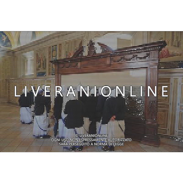 Catholic nuns are watching artwork at the Vatican Museums. Photo by NEWSCOM OUT AG ALDO LIVERANI S A S