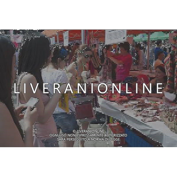 Visitors to the Passport to Taiwan festival in Union Square Park in New York on Sunday, May 29, 2011 inspect crafts made by aboriginal Taiwanese people. The festival, now in its ninth year, promotes the food and culture of Taiwan with music and crafts and is an important event in the Taiwanese-American community in the New York tri-state area. ©photoshot/Agenzia Aldo Liverani Sas - ITALY ONLY - Gli abitanti e Turisti a New York affollano la citta\' nell\'inizio non ufficiale dell\'estate