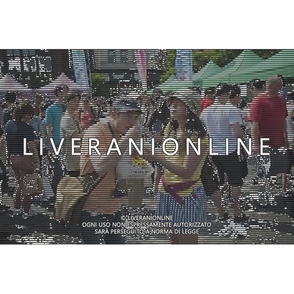 Visitors to the Passport to Taiwan festival in Union Square Park in New York on Sunday, May 29, 2011 eat traditional dishes of shaved ice with mango topping, perfect for the hot, humid day. The festival, now in its ninth year, promotes the food and culture of Taiwan with music and crafts and is an important event in the Taiwanese-American community in the New York tri-state area. ©photoshot/Agenzia Aldo Liverani Sas - ITALY ONLY - Gli abitanti e Turisti a New York affollano la citta\' nell\'inizio non ufficiale dell\'estate