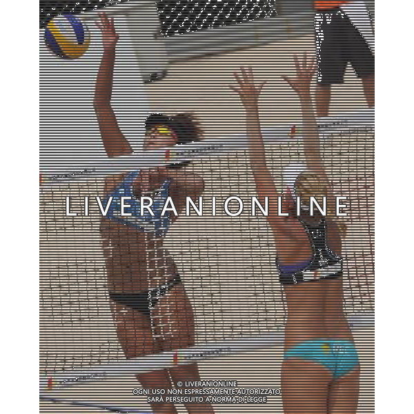 BEIJING, June 10, 2011 China\'s Xue Chen (L) spikes during the women\'s match between China\'s pair Xue Chen/Zhang Xi and Czech Republic\'s pair Slukova/Kolocova at the 2011 FIVB Beach Volleyball Swatch World Tour Beijing Grand Slam in Beijing, capital of China, June 10, 2011. Xue Chen/Zhang Xi won 2 0 to enter the quarterfinals. (/Gong lei)(hcs) VOLLEY - AG ALDO LIVERANI SAS - ITALY ONLY -