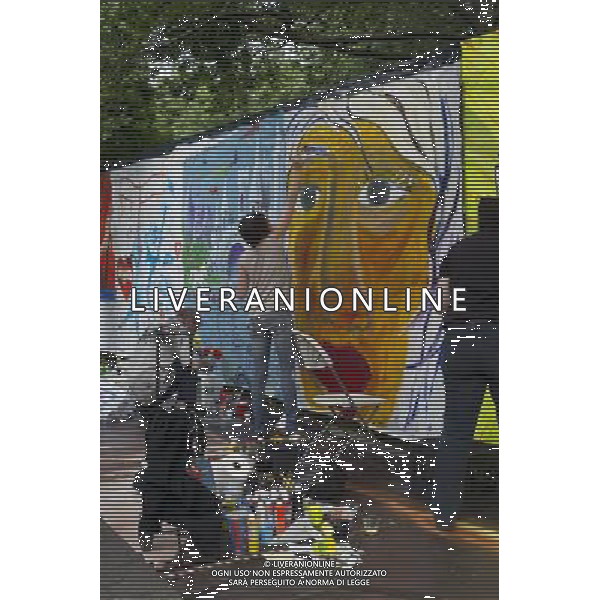 Artists work on their canvas\' at the Howl! Festival\'s \'Art Around the Park\' around Tompkins Square Park in New York\'s East Village. on Saturday, June 4, 2011. The festival, named after poet Allen Ginsberg\'s famous poem, celebrates the arts in the East Village and also consists of other events including performances and poetry readings. The artists are given canvas\' around the perimeter of the park where they work in public view, as a sort of counter-cultural Washington Square Art Show. (å© Frances M. Roberts) /PHOTOSHOT/AG ALDO LIVERANI SAS - ITALY ONLY - *** Local Caption *** .