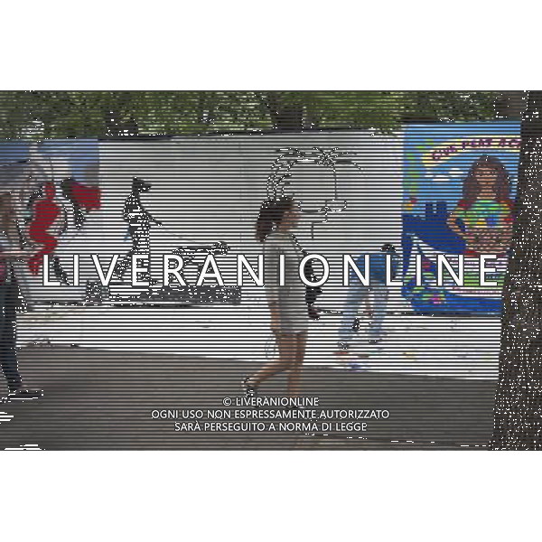 Artists work on their canvas\' at the Howl! Festival\'s \'Art Around the Park\' around Tompkins Square Park in New York\'s East Village. on Saturday, June 4, 2011. The festival, named after poet Allen Ginsberg\'s famous poem, celebrates the arts in the East Village and also consists of other events including performances and poetry readings. The artists are given canvas\' around the perimeter of the park where they work in public view, as a sort of counter-cultural Washington Square Art Show. (å© Richard B. Levine) /PHOTOSHOT/AG ALDO LIVERANI SAS - ITALY ONLY - *** Local Caption *** .