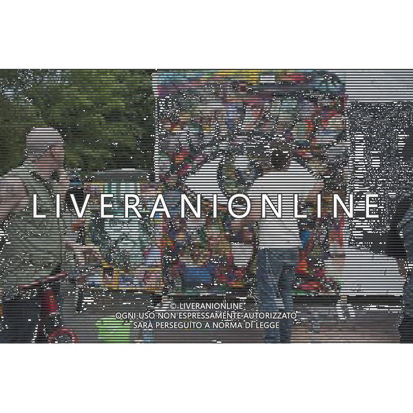 Anthony Zito, right, works on his canvas at the Howl! Festival\'s \'Art Around the Park\' around Tompkins Square Park in New York\'s East Village. on Saturday, June 4, 2011. The festival, named after poet Allen Ginsberg\'s famous poem, celebrates the arts in the East Village and also consists of other events including performances and poetry readings. The artists are given canvas\' around the perimeter of the park where they work in public view, as a sort of counter-cultural Washington Square Art Show. (å© Richard B. Levine) /PHOTOSHOT/AG ALDO LIVERANI SAS - ITALY ONLY - *** Local Caption *** .