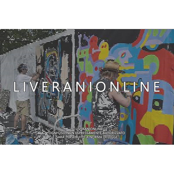 Artists work on their canvas\' at the Howl! Festival\'s \'Art Around the Park\' around Tompkins Square Park in New York\'s East Village. on Saturday, June 4, 2011. The festival, named after poet Allen Ginsberg\'s famous poem, celebrates the arts in the East Village and also consists of other events including performances and poetry readings. The artists are given canvas\' around the perimeter of the park where they work in public view, as a sort of counter-cultural Washington Square Art Show. (å© Richard B. Levine) /PHOTOSHOT/AG ALDO LIVERANI SAS - ITALY ONLY - *** Local Caption *** .