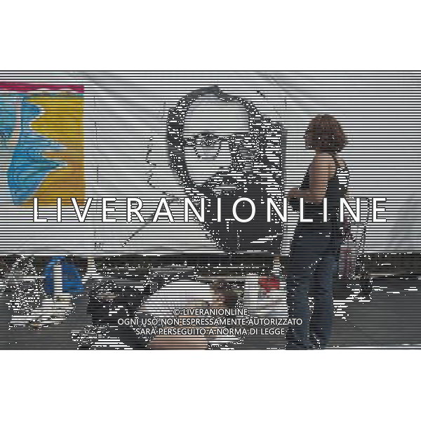 Artists work on their canvas\' at the Howl! Festival\'s \'Art Around the Park\' around Tompkins Square Park in New York\'s East Village. on Saturday, June 4, 2011. The festival, named after poet Allen Ginsberg\'s famous poem, celebrates the arts in the East Village and also consists of other events including performances and poetry readings. The artists are given canvas\' around the perimeter of the park where they work in public view, as a sort of counter-cultural Washington Square Art Show. (å© Richard B. Levine) /PHOTOSHOT/AG ALDO LIVERANI SAS - ITALY ONLY - *** Local Caption *** .