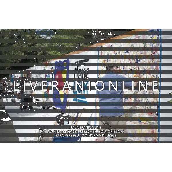 Artists work on their canvas\' at the Howl! Festival\'s \'Art Around the Park\' around Tompkins Square Park in New York\'s East Village. on Saturday, June 4, 2011. The festival, named after poet Allen Ginsberg\'s famous poem, celebrates the arts in the East Village and also consists of other events including performances and poetry readings. The artists are given canvas\' around the perimeter of the park where they work in public view, as a sort of counter-cultural Washington Square Art Show. (å© Richard B. Levine) /PHOTOSHOT/AG ALDO LIVERANI SAS - ITALY ONLY - *** Local Caption *** .